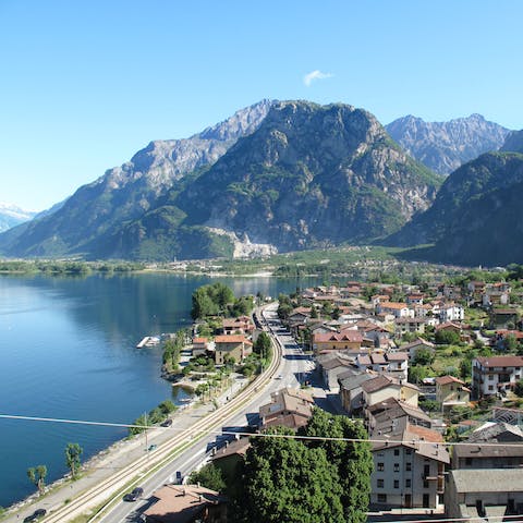 Stay lakeside with breathtaking mountain views across Lago di Mezzola in Lombardy, Italy 