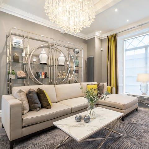 Pop open a bottle of prosecco and get comfortable on the sofa under the chandelier