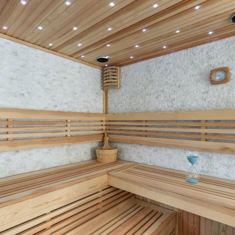 Enjoy a sauna in the villa's private spa