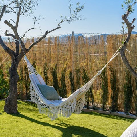 Relax in your hammock with the sun on your face and a good book in your hand