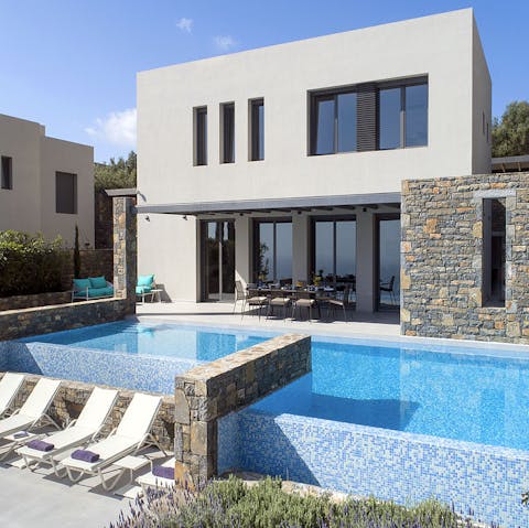 Dive into your private pool to cool off after sunbathing on a comfy lounger