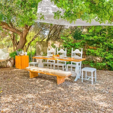 Dine under the shade of trees in the tranquil garden