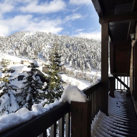 Head out to the slender balcony and breathe in the mountain air