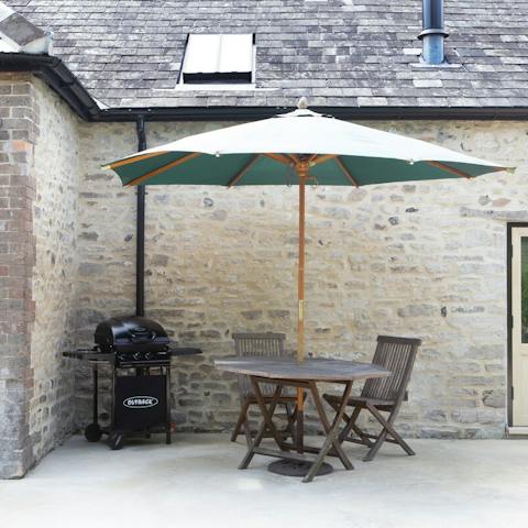 Fire up the outdoor barbecue for an alfresco meal on the patio