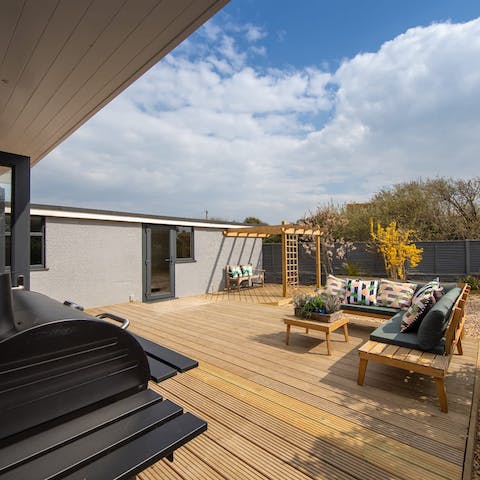 Soak up the sun as the barbecue sizzles in the private garden