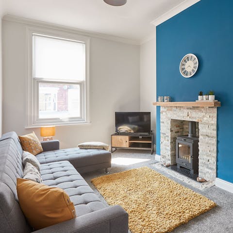 Cuddle up in front of the wood burner fireplace on your stylish L-shaped sofa