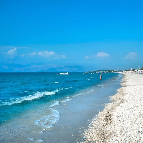 Enjoy a beach day at Paralia Roda, a short drive away