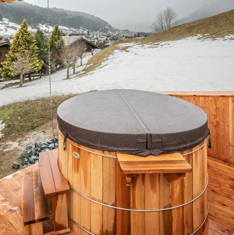 Take in the view with a glass of champagne in your private hot tub 