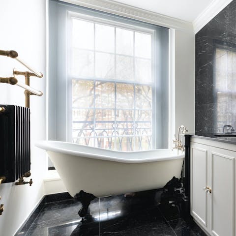 Relax in the clawfoot bathtub after sightseeing around London
