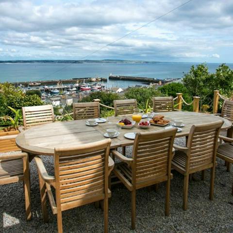 Eat alfresco meals against the backdrop of Newlyn Harbour