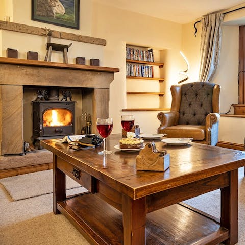Gather around the wood-burning stove for a cosy evening with a glass of malbec