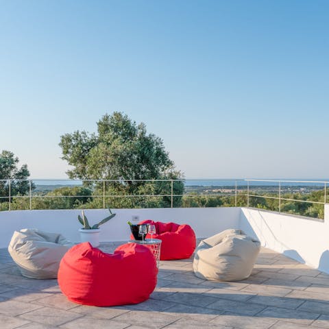 Indulge in sundowners on the beanbags of the rooftop terrace
