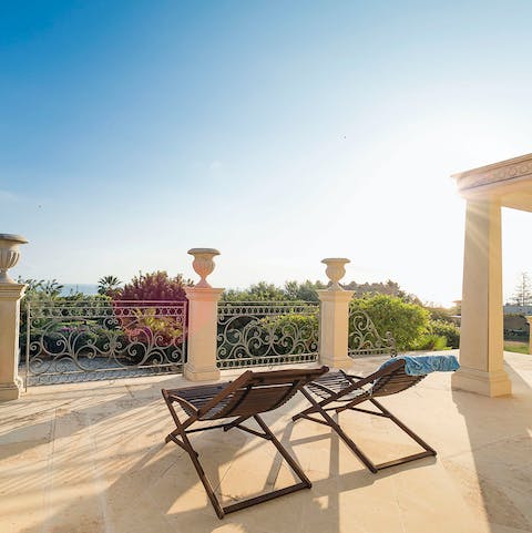 Unwind on the sun loungers while watching the sunset