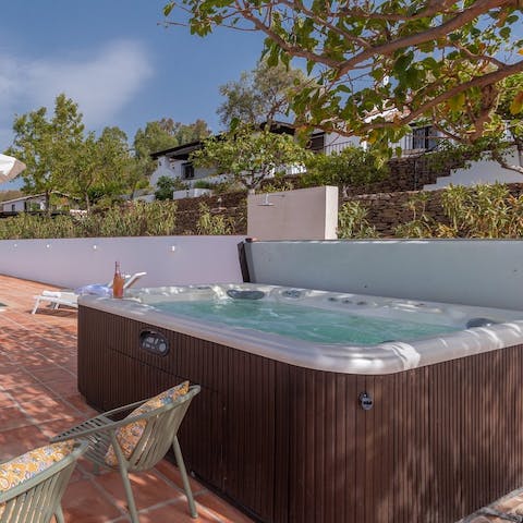Grab your drinks and admire the views from the hot tub as you unwind