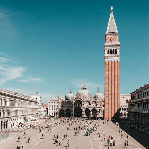 Sip a coffee and people-watch in St Mark's Square, a short walk away