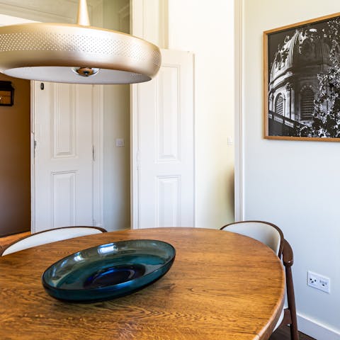 Gather together around the beautiful wooden dining table for sociable meals