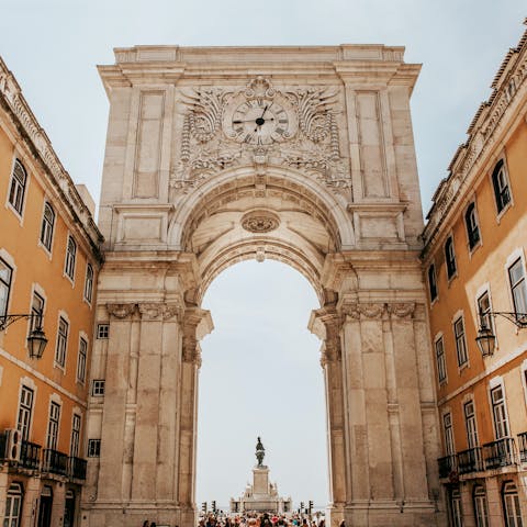 Make your way to the elegant and expansive Praça do Comércio – it's a twenty-minute riverside walk