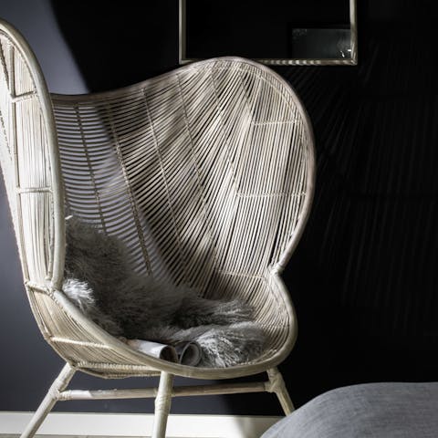 Curl up with a book in the rattan chair 