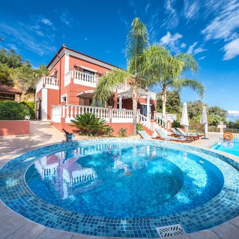 Relax in the Jacuzzi and listen to the swaying palms