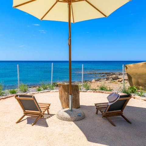 Enjoy stunning sea views in the shade of the parasol