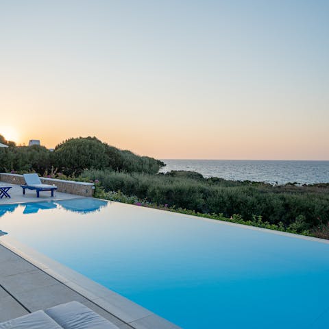 Watch the sunset as you float about in the private swimming pool