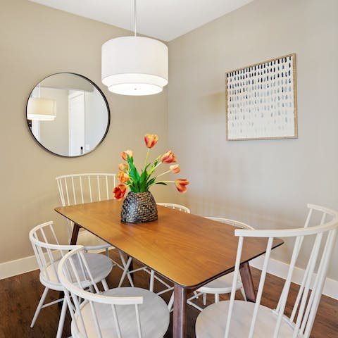 Organise group feasts around the wooden dining table