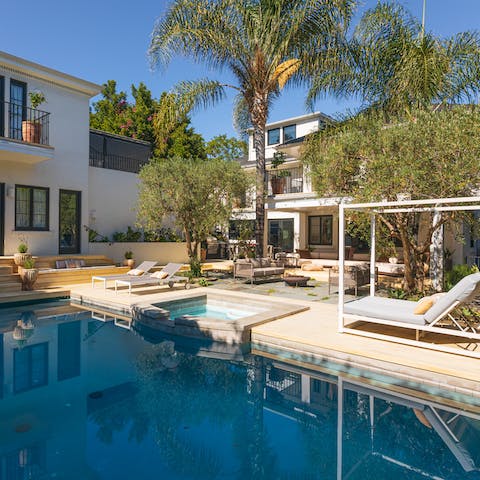 Soak up the LA sunshine from your lush garden oasis and pool area