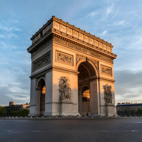 Visit the iconic Arc de Triomphe, a short walk away