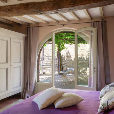 Wake up beneath wood-beamed ceilings and stretch your legs on the patio