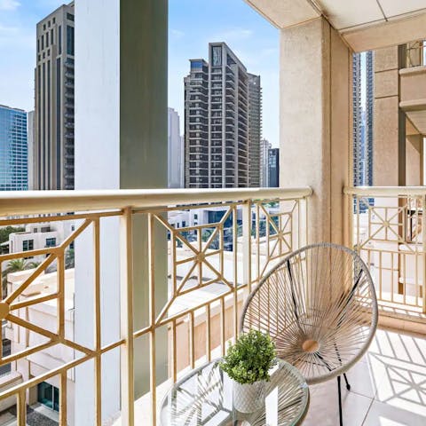 Soak up the city skyline views with your morning coffee on the balcony