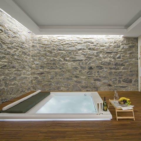Relax and unwind in the villa's wellness room, which includes a sauna and Jacuzzi 