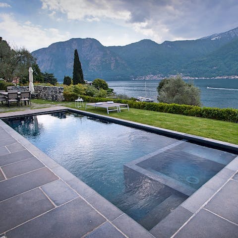 Take a dip in the stunning pool with views over the lake 