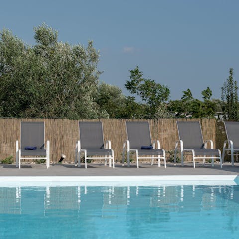 Grab a book or brush up on your Italian in one of the sun loungers