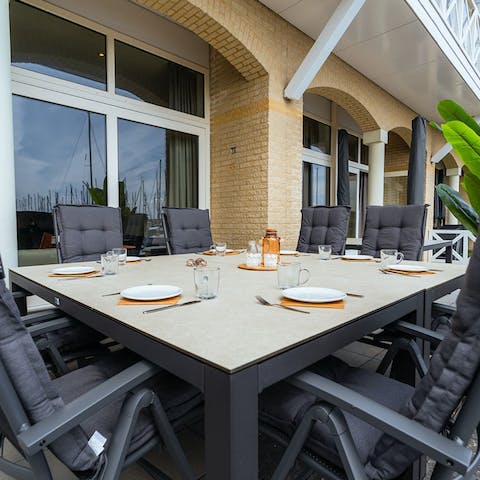 Enjoy a leisurely dinner out on the terrace and gaze out over the harbour