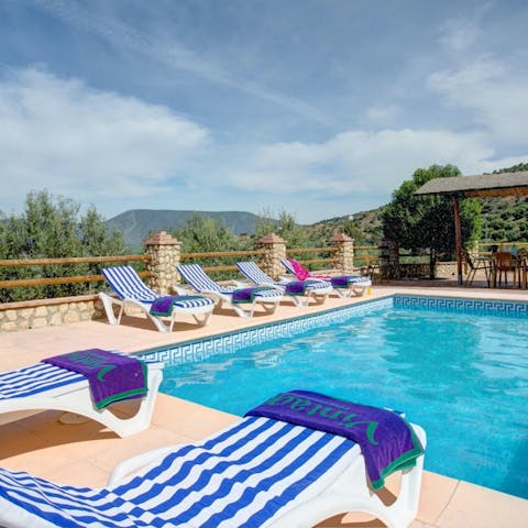 Laze around on the poolside loungers after a day of exploring Andalusia
