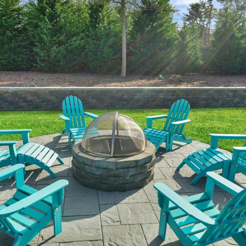 Grab a seat by the fire pit and relax under the warm Suffolk sun