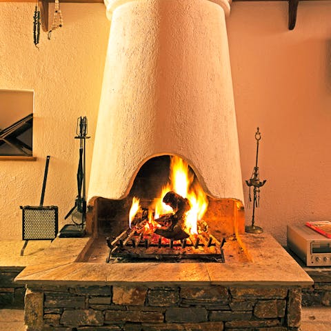 Get cosy beside the traditional log burning fireplace for those cooler, mountain nights