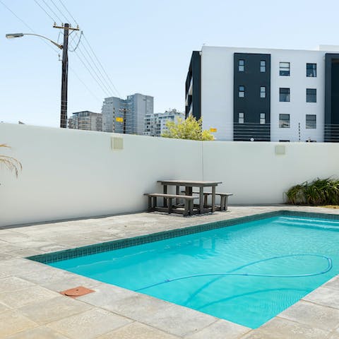 Enjoy a refreshing dip in the communal pool to beat the heat