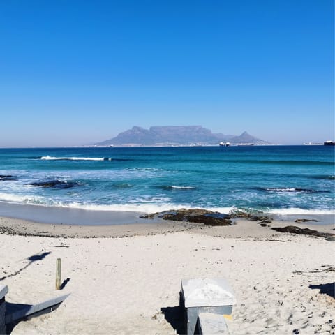 Sink your feet into the sand at nearby Bloubergstrand beach