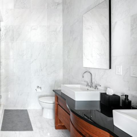 Pamper yourself in the spa-like marble bathroom