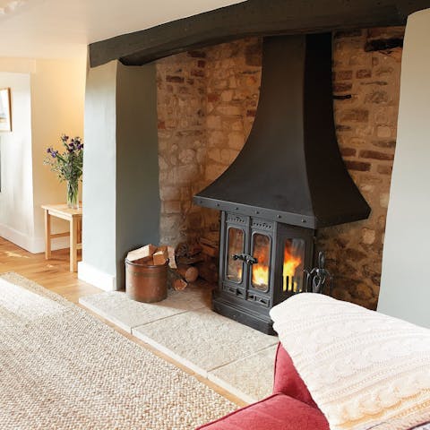 Cosy up by the Inglenook fireplace after a long afternoon of walking