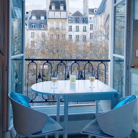 Enjoy views of Parisian rooftops from your dining area