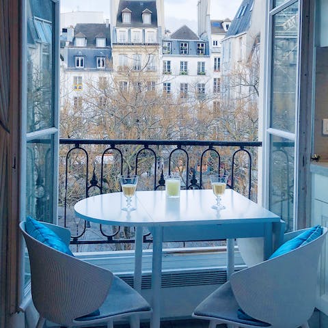 Enjoy views of Parisian rooftops from your dining area