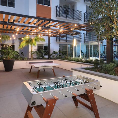 Spend evenings playing ping pong and foosball in the communal outdoor grounds