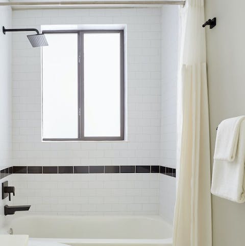 Soak in the bathtub or freshen up in the rainfall shower after a hot day in the city