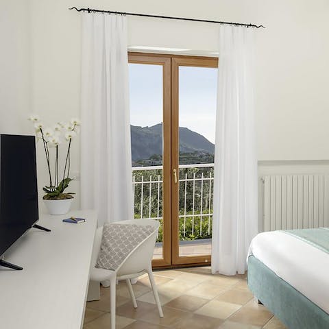 Work remotely in the bedroom or step out onto the private balcony and take in the scenery