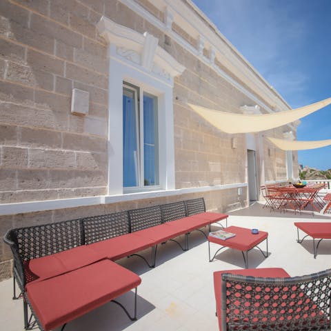 Sip wine on the terrace as you watch the sunset after a day trip to Monopoli