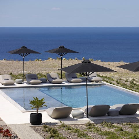Swim in the shared swimming pool and admire the sea views