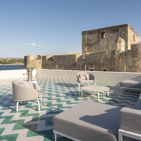 Head up to the rooftop terrace for a sundowner overlooking the old fort