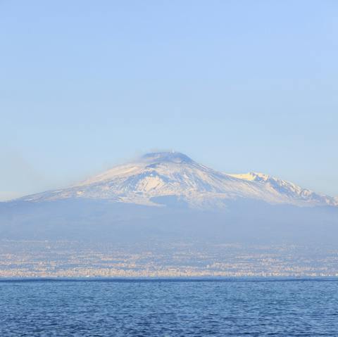 Admire the spectacular view of Mt Etna on the horizon
